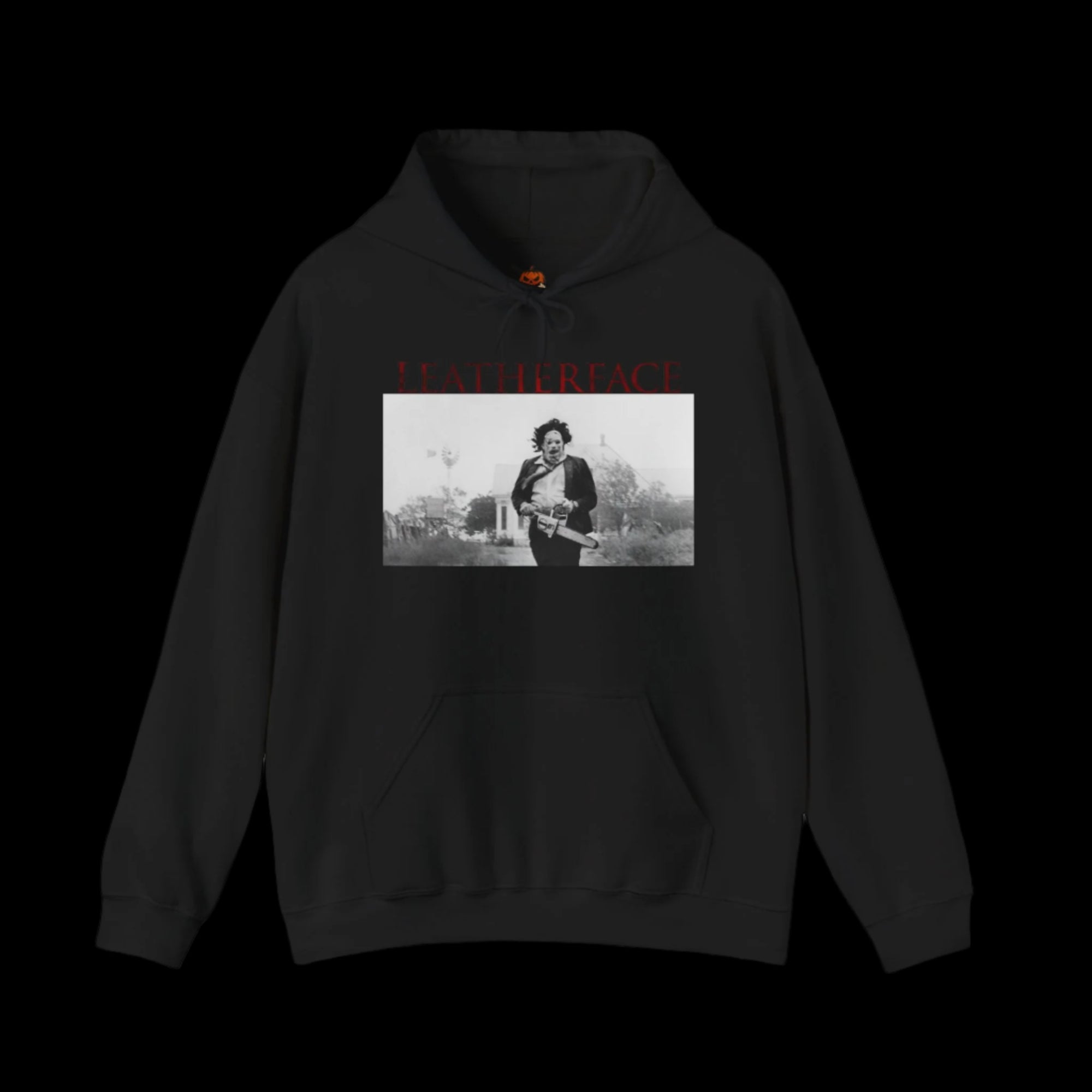 Black hoodie with a graphic of a person holding a gun and text on a black background