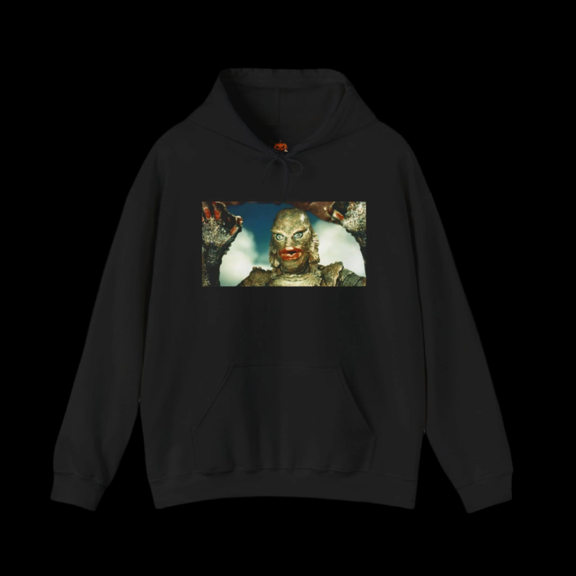 Black hoodie with a graphic of a creature from the black lagoon gill-man and text on a black background