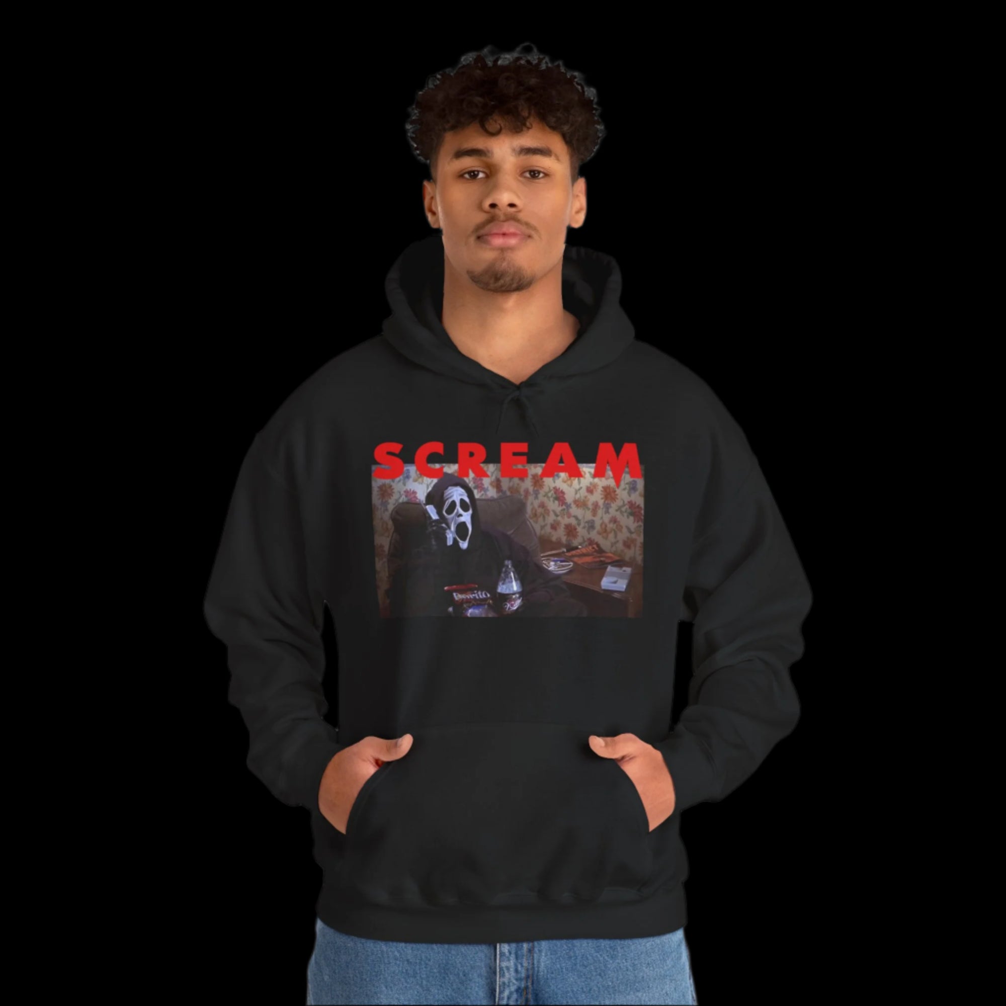 Person wearing a black hoodie with 'SCREAM' graphic design on a white background