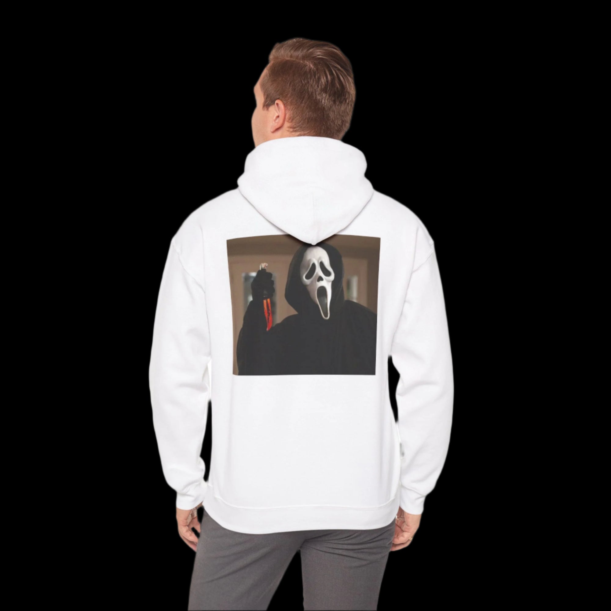 Person wearing a white hoodie with ghostface design on the back, standing against a white background