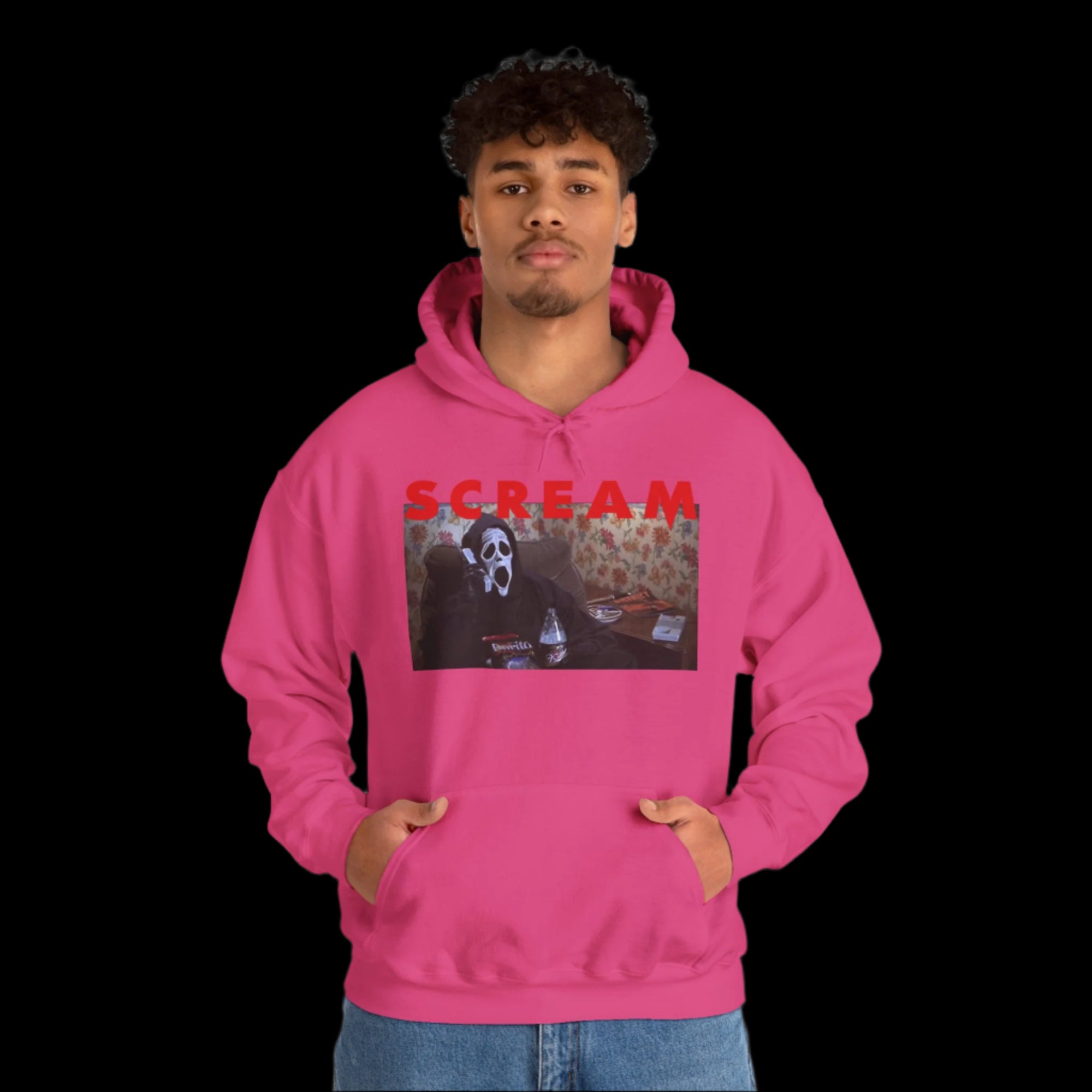 Person wearing a pink hoodie with 'SCREAM' and a graphic design on a white background