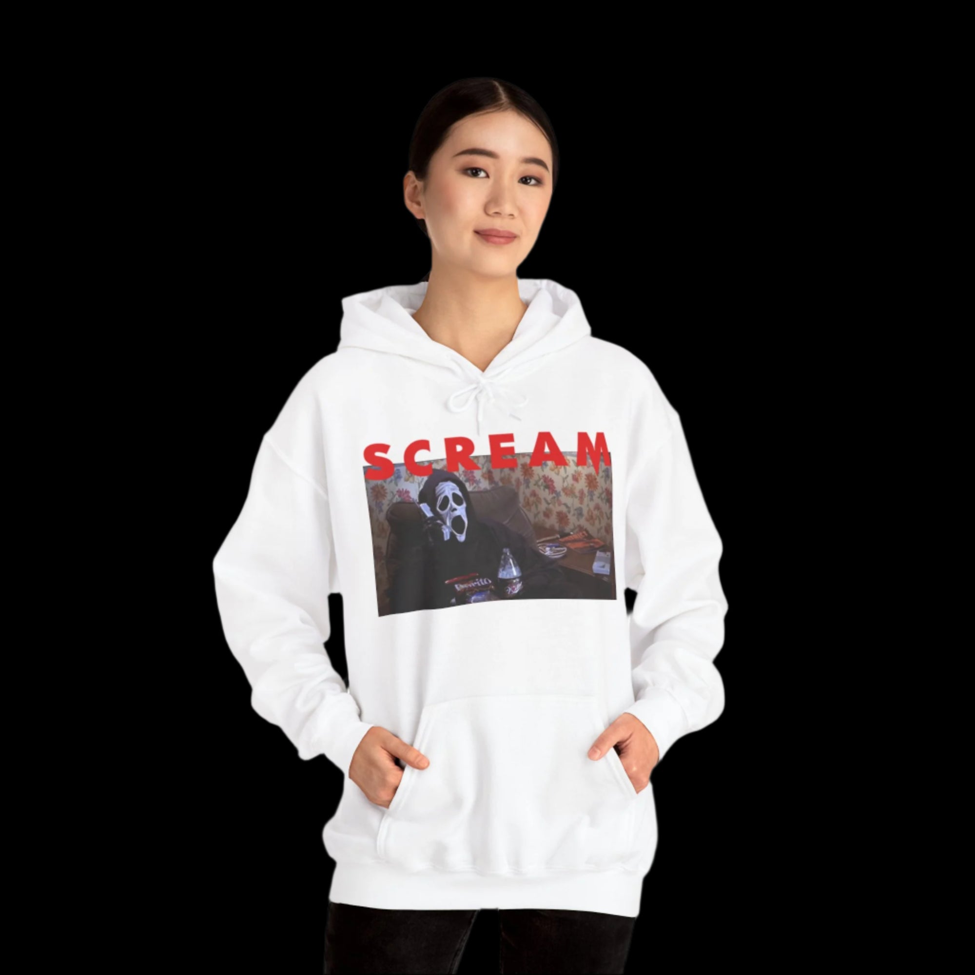 Person wearing a white hoodie with 'SCREAM' text and graphic design on a white background