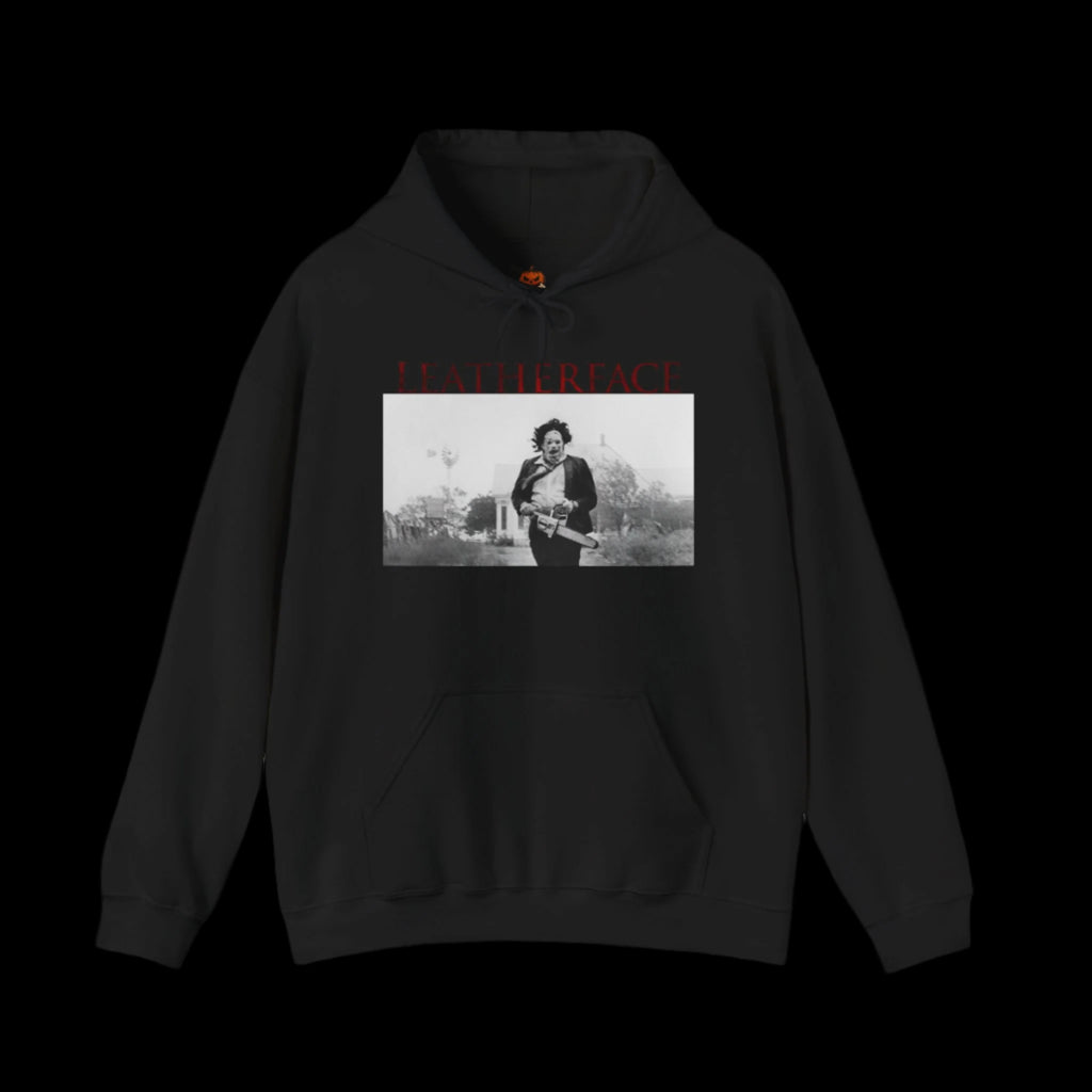 Black hoodie with a graphic of a person holding a gun and text on a black background