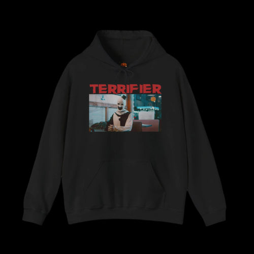 Black hoodie with 'Terrifier' graphic design of Art The Clown on a white background