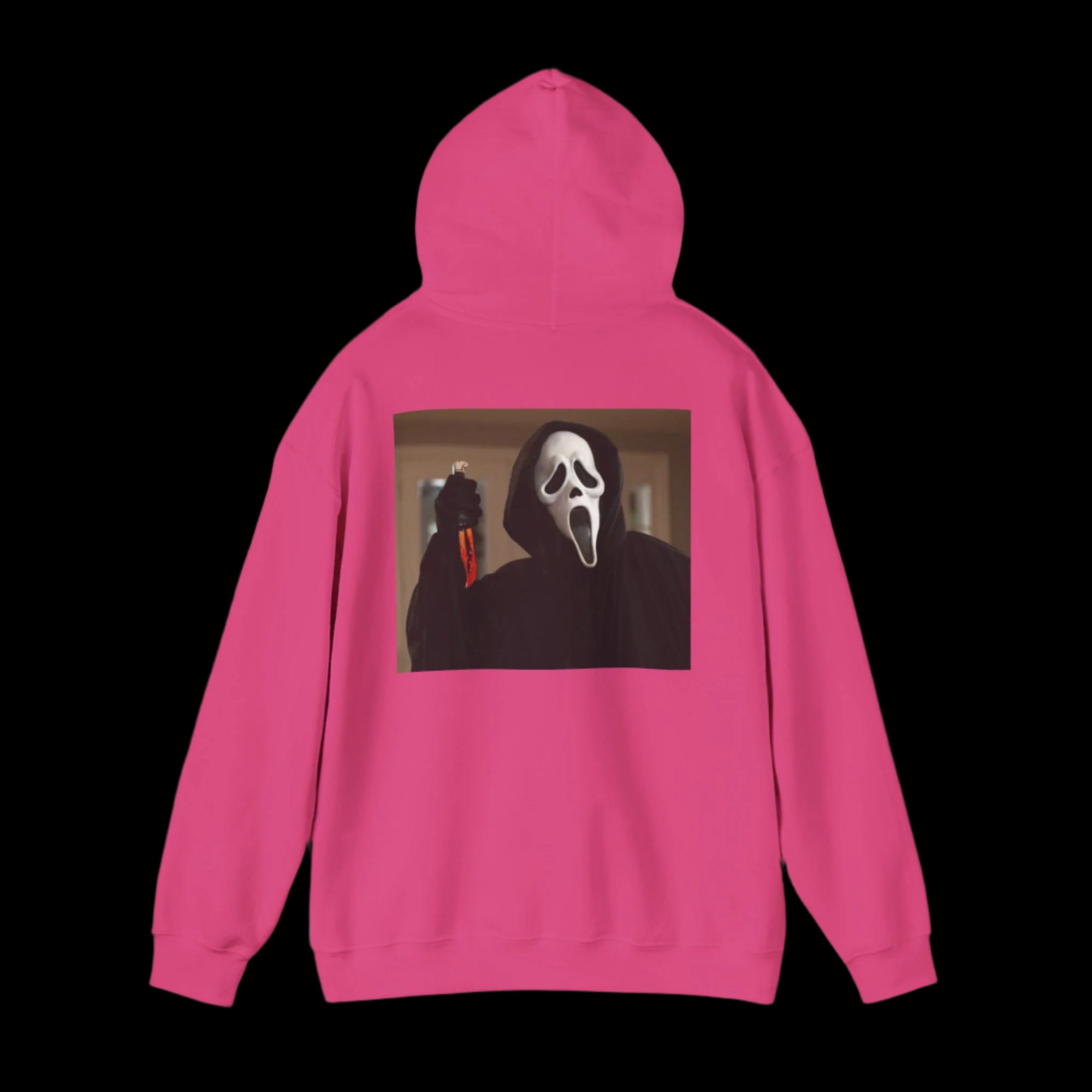 Pink hoodie with a graphic of   ghostface on the back against a white background