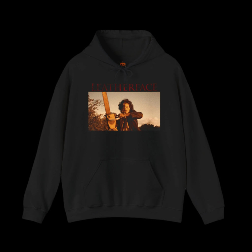 Black hoodie with a graphic of a person holding a chainsaw and 'LEATHERFACE' text on a black background